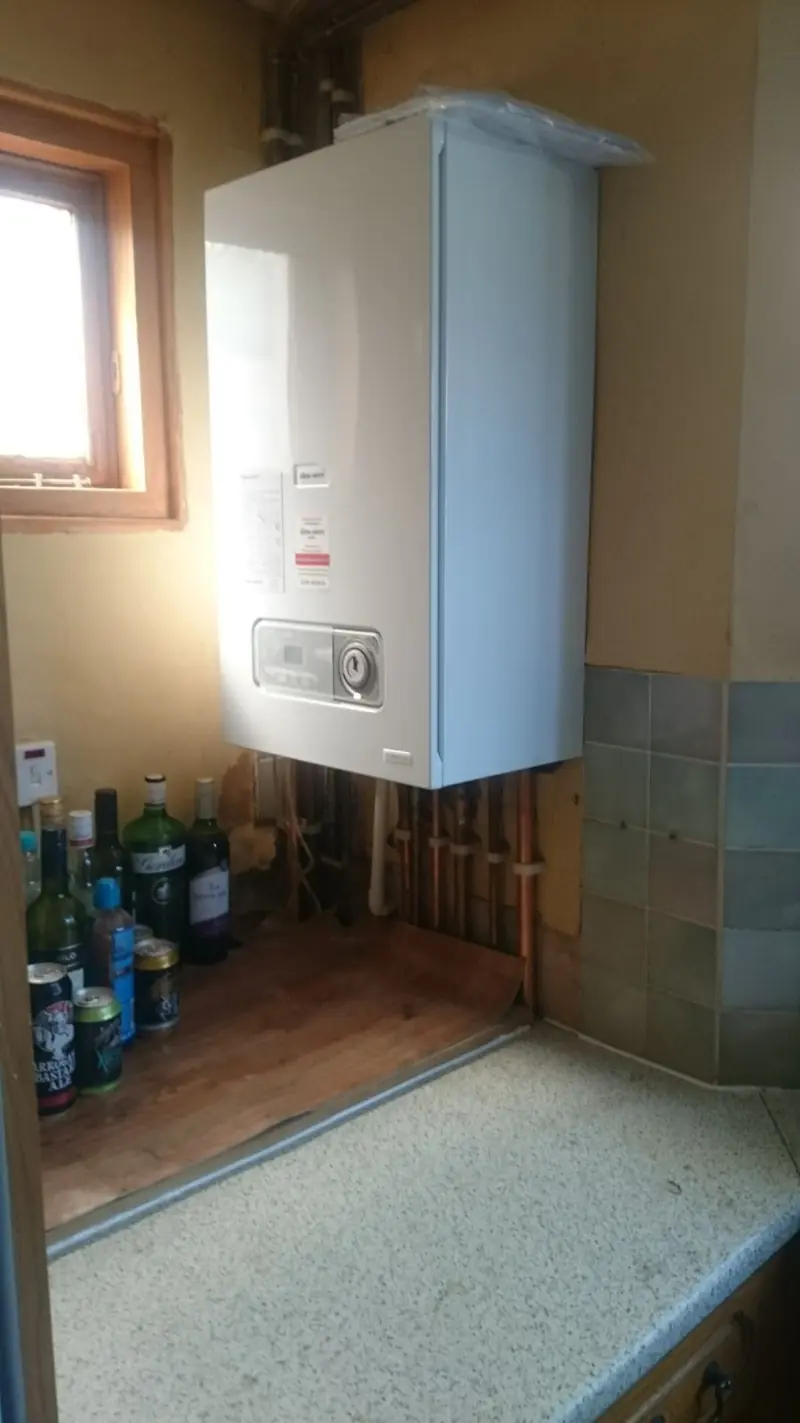 Wall-mounted boiler installed with new copper pipework